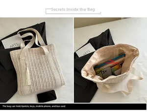 Detail view of large cream woven tote bag interior space with tassel and zipper closure