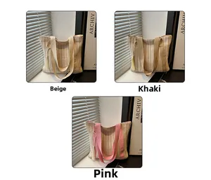 Straw tote bag colors in beige, khaki, and pink with woven texture and tassel detail