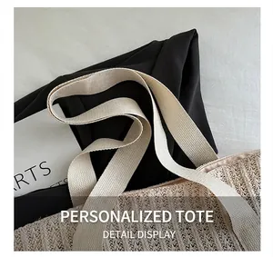 Detailed macro view of woven straw bag texture with cream canvas handle and wave pattern