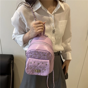 Chic lavender quilted mini backpack with rivets and elegant leather-chain straps for women