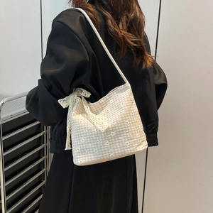 Floral canvas tote bag with white flower embroidery and a lace bow shoulder strap