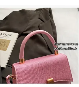 Detail of pink woven leather texture and gold hardware on a stylish shoulder bag