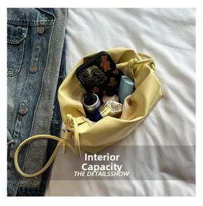 Detail view of internal capacity showing large storage space for phone and makeup