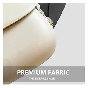 Detailed view of the smooth cream leather texture and rounded corner of this saddle bag