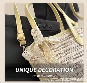 Detail of woven straw bucket bag featuring a delicate white lace bow and gold metal buckle