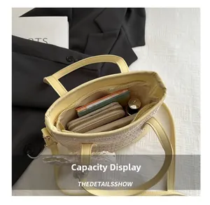 Flat lay of yellow straw bucket bag showing inner lining and daily essentials capacity