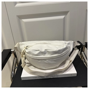 Minimalist white nylon chest bag featuring dual zippers and adjustable woven strap