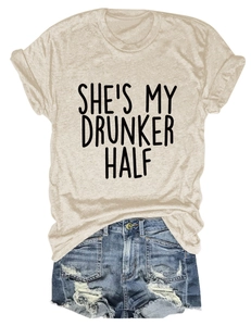 Detail of the printed SHE'S MY DRUNKER HALF quote on a casual crew neck apricot T-shirt