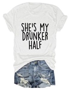 Flat lay of white crewneck T-shirt with black letter print and frayed denim shorts