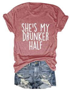 Detail of red crew neck t-shirt with She's My Drunker Half print and denim shorts