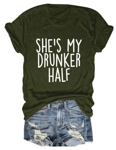 Detail view of olive green cotton T-shirt with She's My Drunker Half print and denim shorts