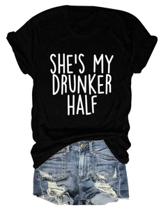 Detailed flat lay of women's black tee with SHE'S MY DRUNKER HALF print and denim shorts