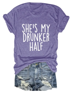 Flat lay of purple cotton T-shirt featuring She's My Drunker Half white letter printing
