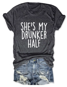 Flat lay of a grey t-shirt with She's My Drunker Half print and ripped denim shorts