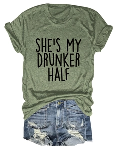 Close-up of olive green crewneck T-shirt featuring SHE'S MY DRUNKER HALF printed text