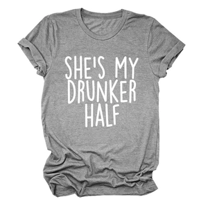 Detail of grey crewneck T-shirt showing rolled cuffs and white slogan print text