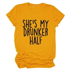 Close-up of mustard yellow cotton T-shirt featuring She's My Drunker Half black lettering