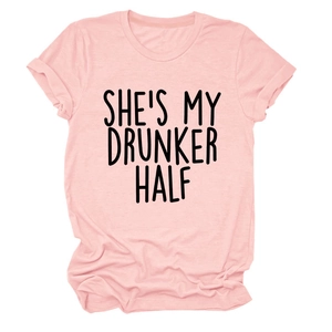 Detail of light pink t-shirt with black She's My Drunker Half slogan print