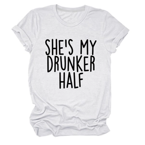 Detail of white cotton crew neck t-shirt featuring black SHE'S MY DRUNKER HALF text print