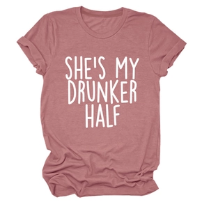 Detail of rose pink t-shirt featuring She's My Drunker Half white graphic print