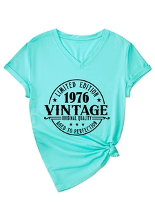 Detail of mint green V-neck T-shirt showing Limited Edition 1976 vintage graphic print