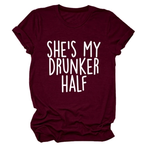 Close-up of wine red crew neck t-shirt featuring She's My Drunker Half white lettering