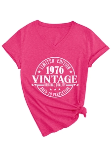 Detail of rose pink V-neck t-shirt featuring 1976 vintage print and front knot design