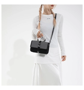 Fashionable black and grey woven patchwork leather handbag with silver metallic handle