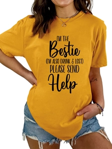 Close-up of gothic slogan print on yellow cotton crew neck T-shirt with denim shorts