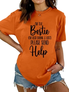 Detail of orange crew neck T-shirt with I'M THE Bestie black letter print