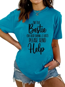 Detail of teal crew neck t-shirt with I'm the bestie slogan and denim shorts