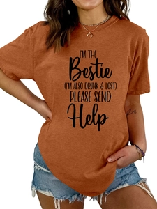 Close-up of terracotta crew neck t-shirt with screen printed bestie slogan and cotton texture