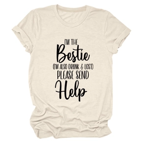 Detail of cream crew neck T-shirt with black I'M THE BESTIE slogan on a flat lay