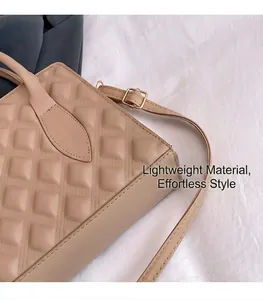 Detailed close-up of beige quilted leather handbag with premium gold-tone hardware detail