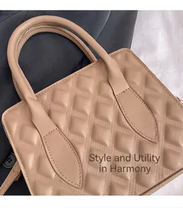 Close-up of beige quilted tote bag showing fine diamond stitching and glossy PU leather texture