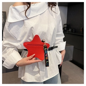 Fashionable red star-shaped coin purse with LOVE webbing strap on a white shirt model