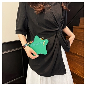 Detail of green star-shaped coin purse with textured finish and woven LOVE wristlet