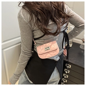 Pink quilted mini chain bag with silver twist lock shown on a model for daily wear