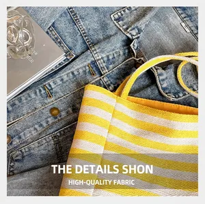 Close-up of durable yellow and white striped woven canvas fabric on a large tote bag