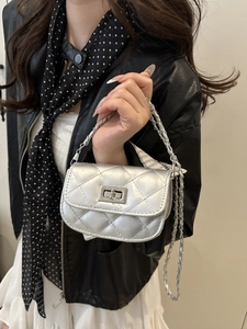 Chic silver quilted crossbody bag with metal chain strap and turn-lock closure