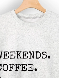 Detail of grey heather sweatshirt neck with bold black WEEKENDS COFFEE printed text