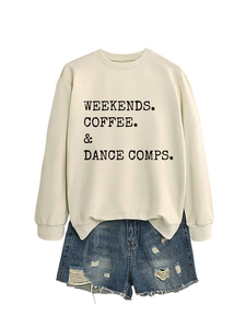 Detail of off-white crewneck sweatshirt with black slogan paired with frayed denim shorts