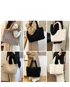 Detail of plush tote bag featuring vertical stripes and decorative faux fur ball handle