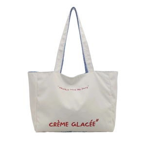 Chic off-white canvas tote bag with red French lettering and striped lining details