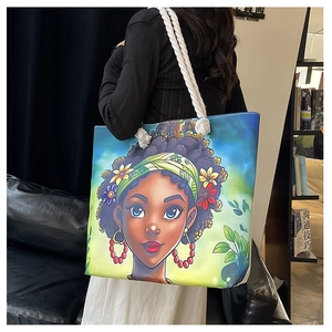 Détail du sac cabas en toile avec portrait africain et anses épaisses en corde de coton