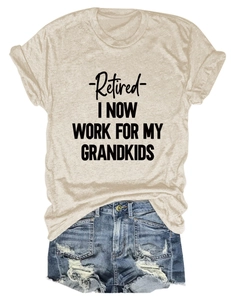 Flat lay of a beige t-shirt with Retired print and distressed denim shorts with fringe