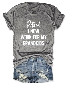 Detail of grey crewneck T-shirt with white Retired slogan paired with denim shorts