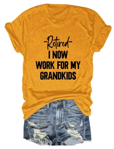 Flat lay of mustard yellow t-shirt with Retired I Now Work design and denim shorts