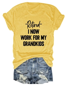 Flat lay of yellow t-shirt with Retired slogan and distressed denim shorts summer set