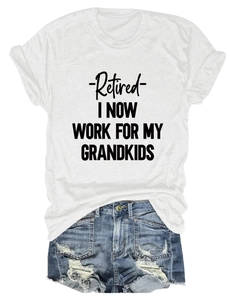 Detail of white cotton T-shirt with 'Retired' text print and ripped denim shorts set